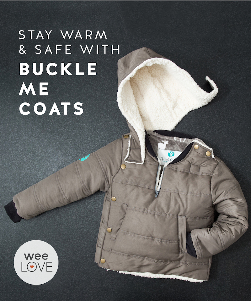 a khaki colored buckle me coat with hood, a winter coat that's safe to use in a car seat, lies flat on a dark background. Text reads: "weelove: stay warm and safe with buckle me coats"